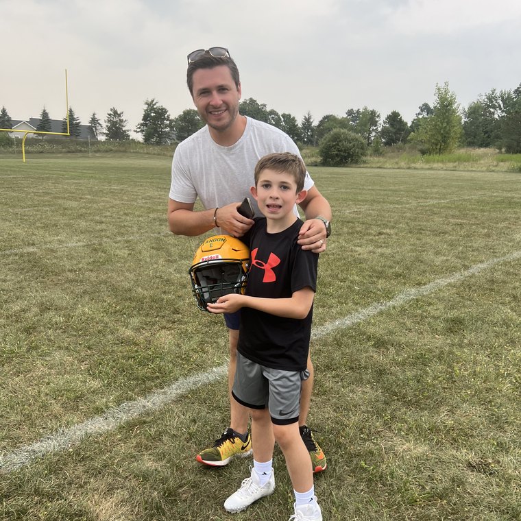 Kyle Evans on a football field after practice.